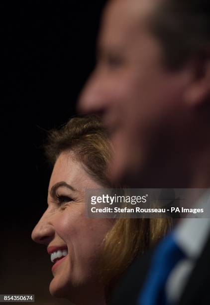 Karren Brady and Prime Minister David Cameron listen to Chancellor of the Exchequer George Osborne as he delivers his keynote speech on the second...