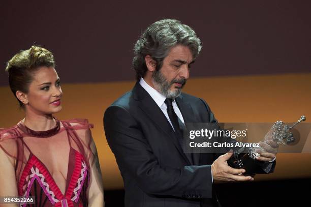 Ricardo Darin receives the Donostia Award from actress Dolores Fonzi at the Kursaal Palace during the 65th San Sebastian International Film Festival...