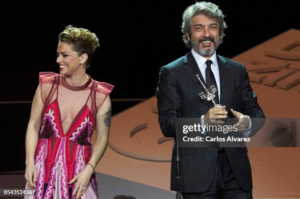 Ricardo Darin receives the Donostia Award from actress Dolores Fonzi at the Kursaal Palace during the 65th San Sebastian International Film Festival...