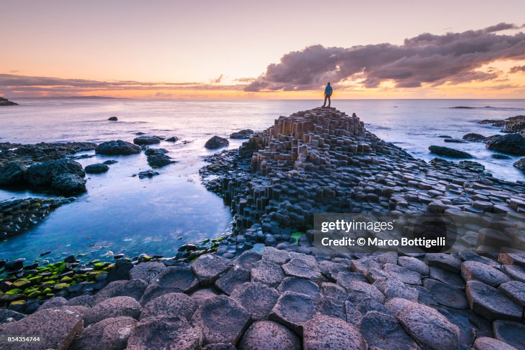 Tourist at the Giant's Causeway, Northern Ireland.