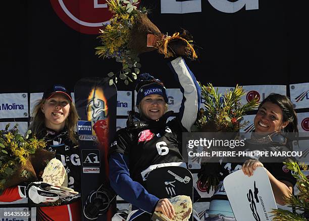 Austria's Marion Kreiner , winner Germany's Amelie Kober and US Michelle Gorgone celebrate on the podium of the women's World Cup parallel giant...