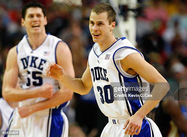 Jon Scheyer of the Duke Blue Devils reacts after hitting a three-point basket against the Florida State Seminoles during the championship game of the...