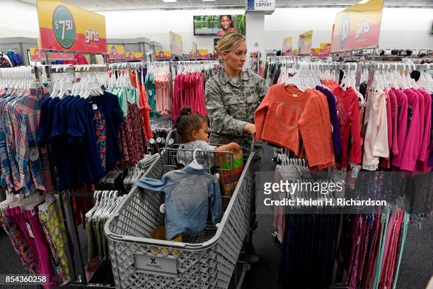 Air Force tech sgt. Alicia Corbett shops with her daughter Londyn at the Army & Air Force Exchange Service at Buckley Air Force Base on September 25,...
