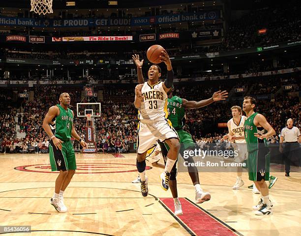 Danny Granger of the Indiana Pacers drives hard to the basket and looks to finish the drive with a layup during a game against the Toronto Raptors on...