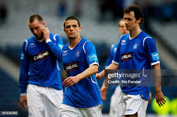 Defeated Rangers players Nach Novo and Christian Dailly leave the pitch after loosing the CIS Insurance Cup Final between Rangers and Celtic at...