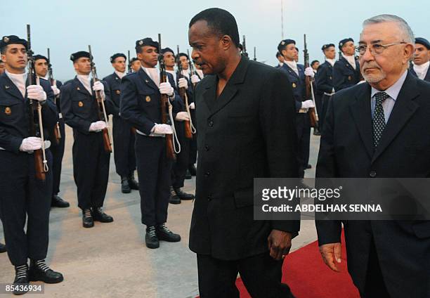 The late first lady of Gabon's father and president of Congo Denis Sassou Nguesso walks with Moroccan Justice Minister Abdeouahed Radi Radi on...
