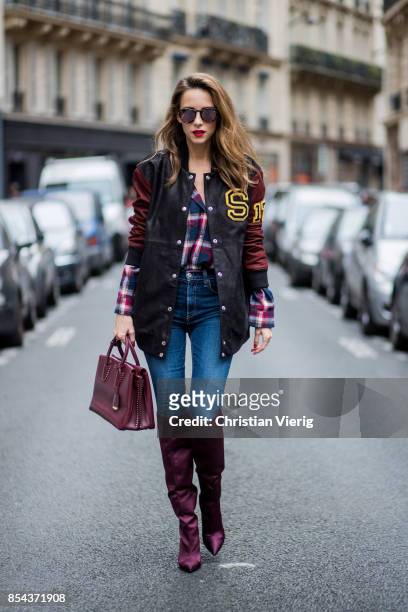 Alexandra Lapp wearing an oversized college jacket in leather from Set Fashion, a plaid shirt with studs from Set, high waist skinny jeans by Rag and...