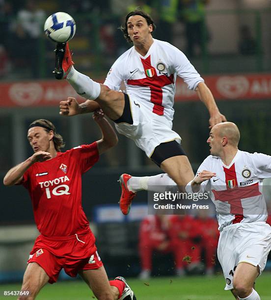 Zlatan Ibrahimovic and Esteban Cambiasso of Inter in action with and Per Kroldrup of Fiorentina during the Serie A match between Inter and Fiorentina...