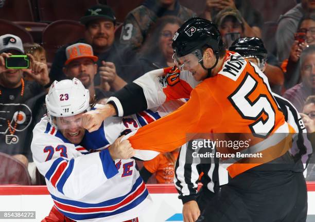 Samuel Morin of the Philadelphia Flyers lands a punch during a first-period fight against Bobby Farnham of the New York Rangers during a preseason...