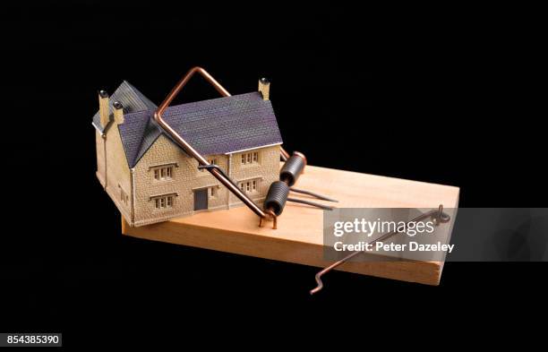 mousetrap with a house trapped inside - eviction stock pictures, royalty-free photos & images