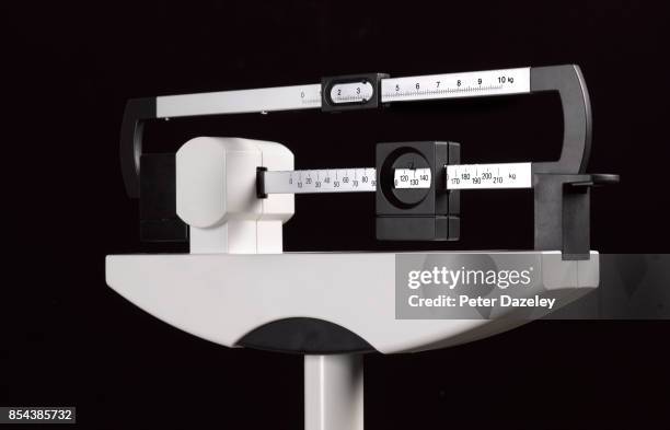 overweight medical scales on black - weight scale stock pictures, royalty-free photos & images