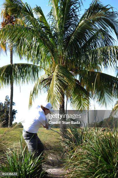 Phil Mickelson hits out of the tall grass onto the 12th fairway during the final round of the World Golf Championships-CA Championship held at Doral...