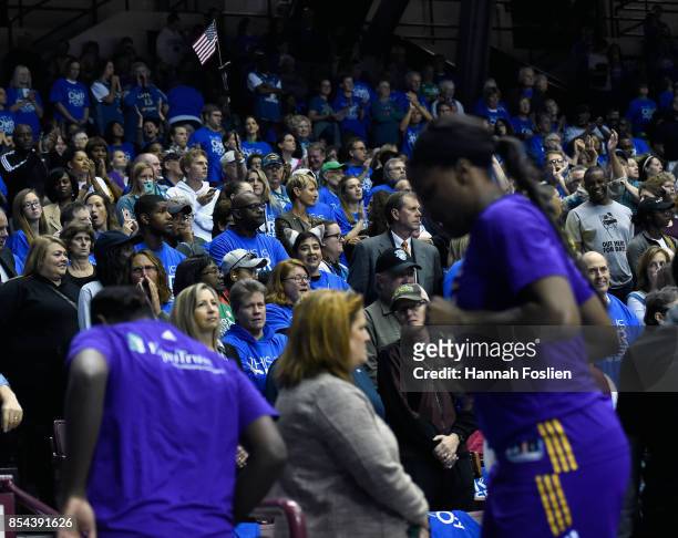 Fans look on as the Los Angeles Sparks leave the court prior to the National Anthem before Game Two of the WNBA Finals against the Minnesota Lynx on...