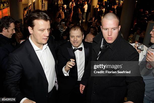 Constantin Film Torsten Koch and actor Mario Barth between bodyguards at the premiere of 'Maennersache' at cinemaxx on March 15, 2009 in Berlin,...