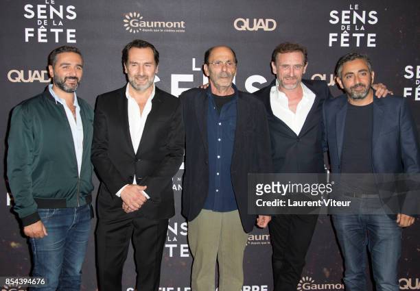 Eric Toledano, Gilles Lellouche, Jean-Pierre Bacri, Jean-Paul Rouve and Olivier Nakache attend "Le Sens De La Fete" Paris Premiere at Le Grand Rex on...