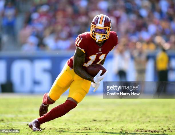 Terrelle Pryor of the Washington Redskins runs after his catch during the game against the Los Angeles Rams at Los Angeles Memorial Coliseum on...