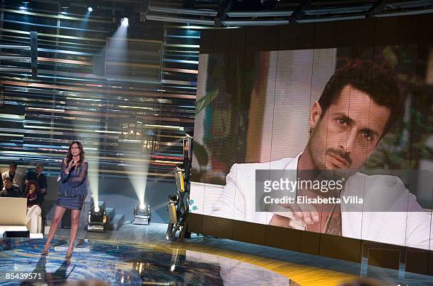 Presenter Paola Perego speaks with on live television broadcast from Brazil Fabrizio Corona during `La Fattoria` Italian TV Show on March 15, 2009 in...