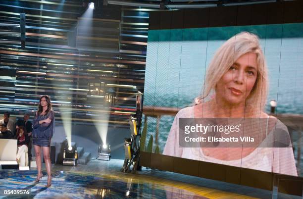 Presenter Paola Perego speaks with on live television broadcast from Brazil Mara Venier during `La Fattoria` Italian TV Show on March 15, 2009 in...