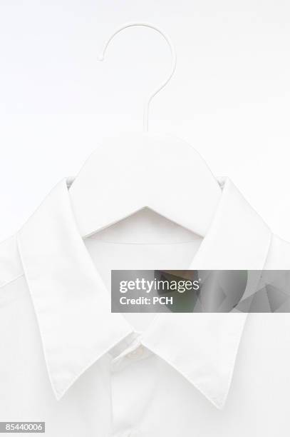 hi-key white shirt on hanger - white shirt stock pictures, royalty-free photos & images