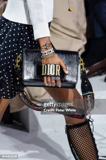 Model, bag detail, walks the runway during the Christian Dior show as part of the Paris Fashion Week Womenswear Spring/Summer 2018 on September 26,...