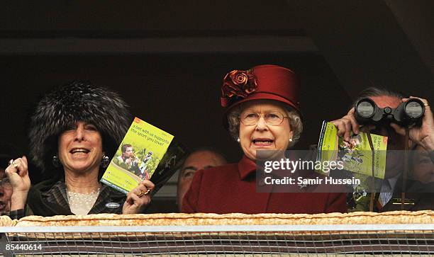 Queen Elizabeth II watches a race on Gold Cup day at the Cheltenham Festival on March 13, 2009 in Cheltenham, England.