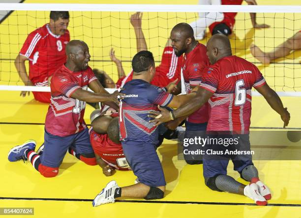 Team United Kingdom celebrate their victory against Team Jordan on Day Four in the Vollyball preliminary rounds during the 2017 Invictus Games at...