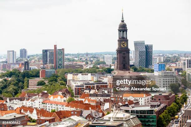 hamburg skyline with old and new architecture, germany - turmuhr stock-fotos und bilder