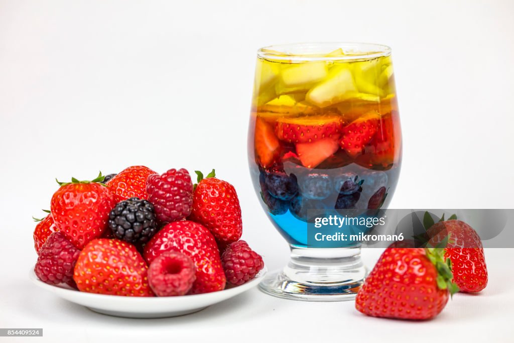 Rainbow Jello with strawberry's, blueberry, banana and pear with fresh berry fruits, homemade dessert