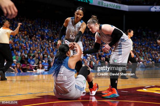 Maya Moore and Lindsay Whalen help up Plenette Pierson of the Minnesota Lynx during the game against the Los Angeles Sparks in Game Two of the 2017...