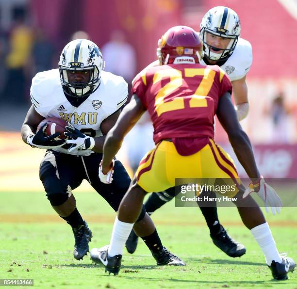 Jamauri Bogan of the Western Michigan Broncos cuts back on Ajene Harris of the USC Trojans at Los Angeles Memorial Coliseum on September 2, 2017 in...