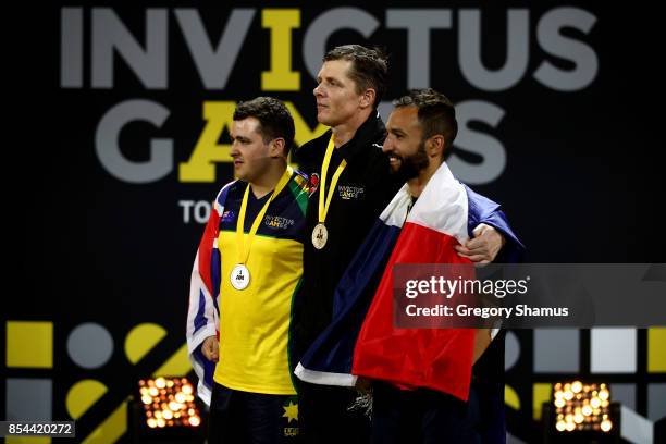 Silver medalist Nathan Parker of Australia, gold medalist Craig Wilson of New Zealand and bronze medalist Jonathan Hamou of France pose on the podium...