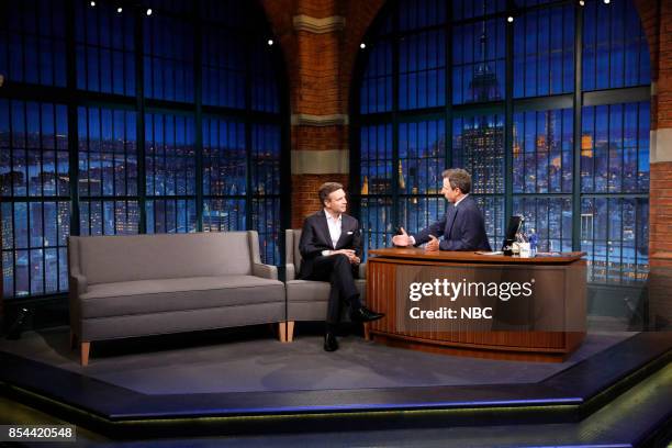 Episode 584 -- Pictured: Former White House Press Secretary Josh Earnest talks with host Seth Meyers during an interview on September 26, 2017 --