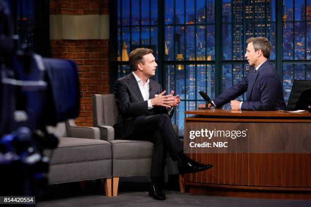 Episode 584 -- Pictured: Former White House Press Secretary Josh Earnest talks with host Seth Meyers during an interview on September 26, 2017 --