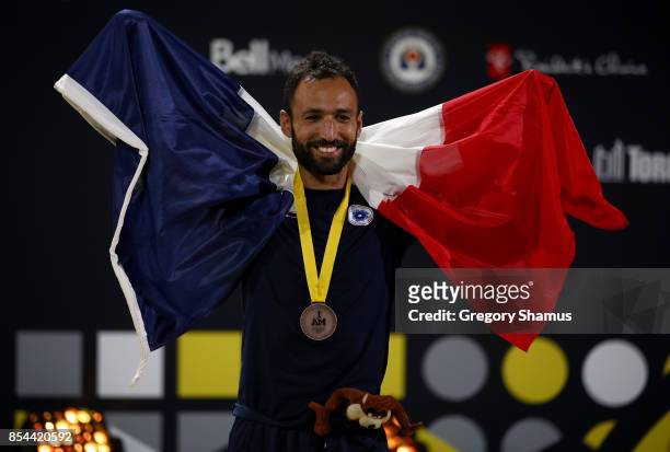 Bronze medalist Jonathan Hamou of France poses on the podium at the medal ceremony for the Indoor Rowing Men's IR3 Four Minute Endurance Final during...