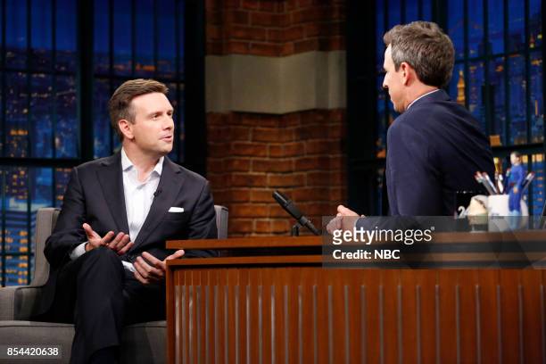 Episode 584 -- Pictured: Former White House Press Secretary Josh Earnest talks with host Seth Meyers during an interview on September 26, 2017 --