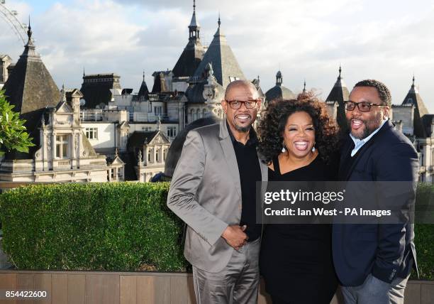 Forest Whitaker and Oprah Winfrey, with director Lee Daniels during a photocall for their new film The Butler, at the Corinthia Hotel in London.