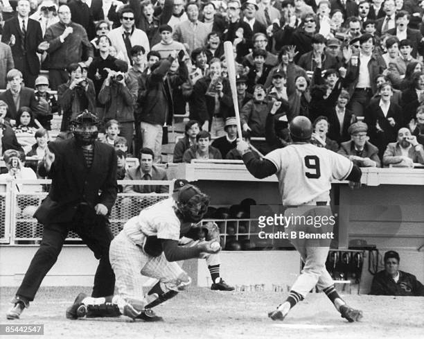 American baseball player Jerry Grote , catcher for the New York Mets, catches the ball after a missed swing by Al Ferrara of the San Diego Padres...