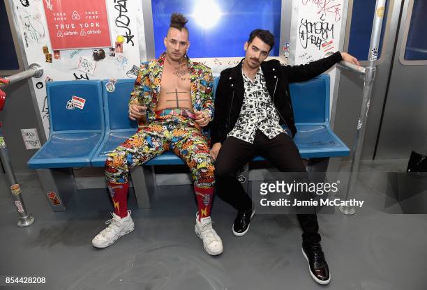 Cole Whittle and Joe Jonas of DNCE pose during Airbnb's New York City Experiences Launch Event on September 26, 2017 in the Brooklyn borough of New...