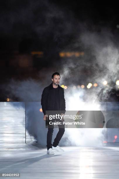 Anthony Vaccarello acknowledges the audience after the Saint Laurent show as part of the Paris Fashion Week Womenswear Spring/Summer 2018 on...