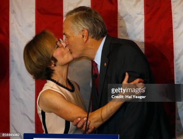 Sen. Luther Strange kisses his wife Melissa as he makes his concession speech after losing to Roy Moore in a GOP runoff election on September 26,...
