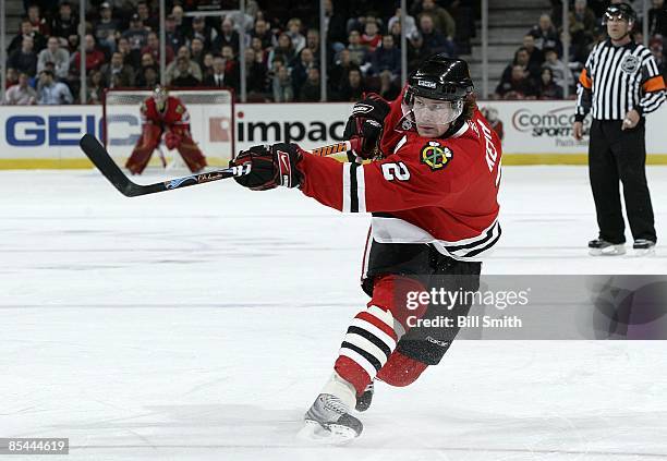 Duncan Keith of the Chicago Blackhawks shoots the puck during a game against the Columbus Blue Jackets on March 13, 2009 at the United Center in...