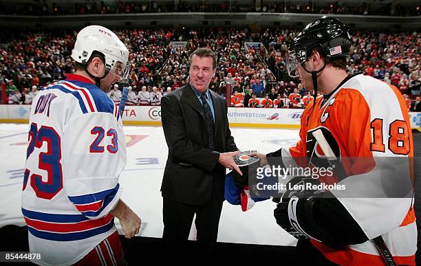 Retired NHL Linseman Pat Dapuzzo stands center during a jersey presentation with Mike Richards of the Philadelphia Flyers and Chris Drury of the New...