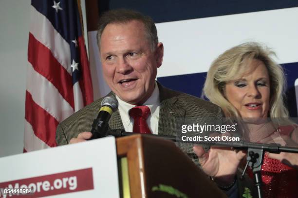 Republican candidate for the U.S. Senate in Alabama, Roy Moore and his wife Kayla greet supporters at an election-night rally on September 26, 2017...