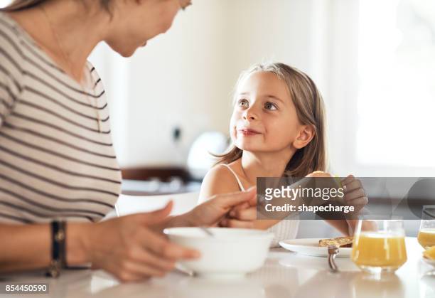 this orange is so yummy, mummy - family small kitchen stock pictures, royalty-free photos & images