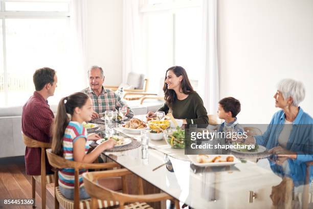 lunching with the family - lunching stock pictures, royalty-free photos & images