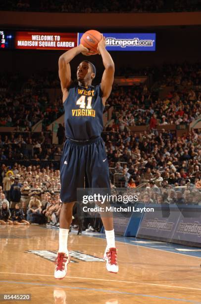 John Flowers of the West Virginia Mountaineers takes a jump shot during a quarterfinal Big East Conferance Touranment college basketball game against...