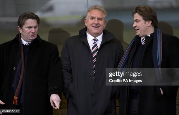Rangers CEO Graham Wallace in the stands alongside Sandy and James Easdale during the Scottish League One match at Ochilview Park, Stenhousemuir