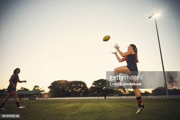 it’s more than just a game of throw and catch - football australien stock pictures, royalty-free photos & images