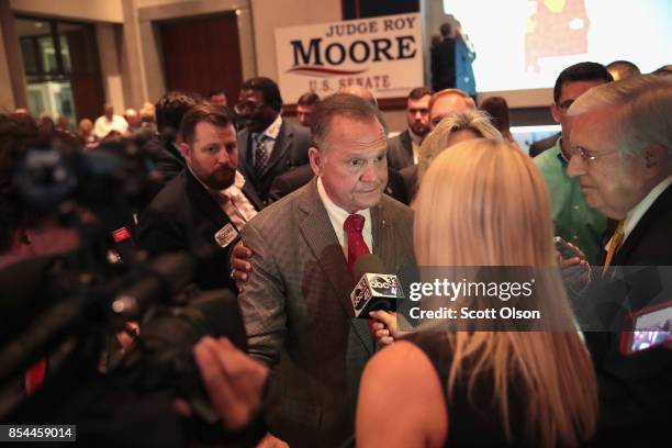 Republican candidate for the U.S. Senate in Alabama, Roy Moore speaks to reporters at an election-night rally after declaring victory on September...