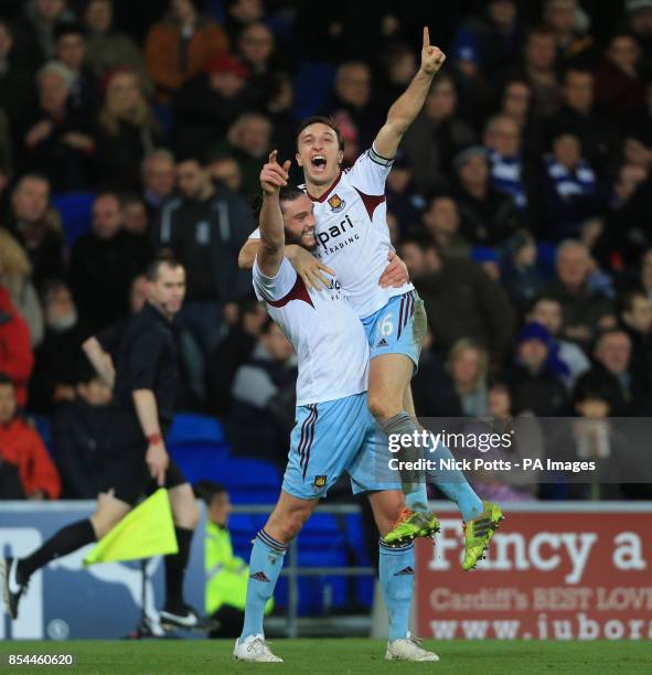 West Ham United's Mark Noble celebrates scoring the 2nd goal with Andy Carroll during the Barclays Premier League match at Cardiff City Stadium,...